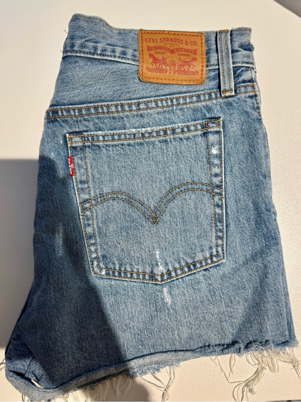 Levi's Light Wash Denim wedgie short with Raw Hem